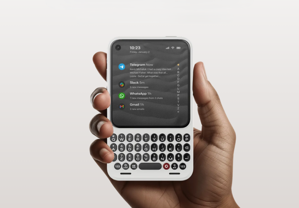 The Clicks communicator in hand.